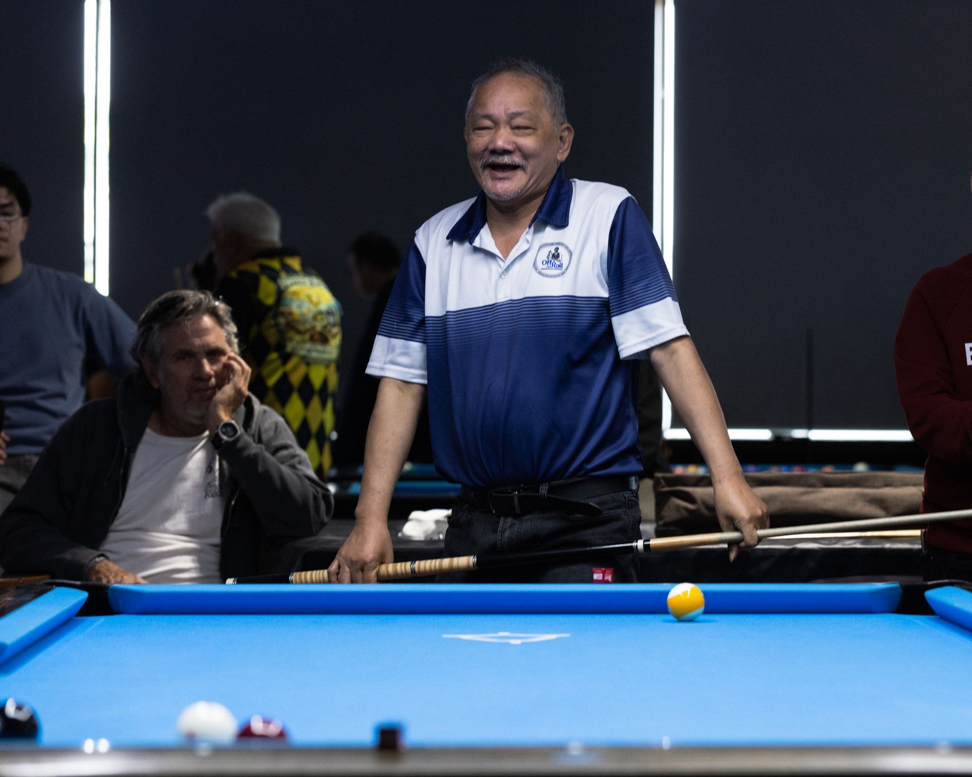 Pool tables and house lighting at Good Times Billiards in Lakewood, California